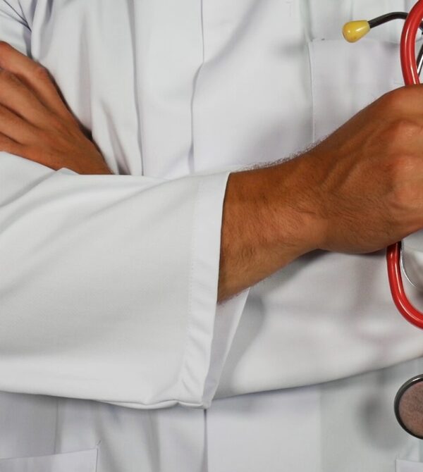 doctor holding red stethoscope